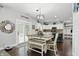 Bright dining area features a decorative table with bench seating, and stylish chandelier lighting at 1281 Jesse Ct, Greenwood, IN 46143