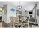 Bright dining area connected to living space features a decorative table with four chairs at 1281 Jesse Ct, Greenwood, IN 46143