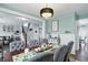 Dining area with views of the staircase and living area, complemented by a chandelier at 1281 Jesse Ct, Greenwood, IN 46143
