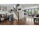 Welcoming entryway with hardwood floors, staircase, and an open view into the living room at 1281 Jesse Ct, Greenwood, IN 46143