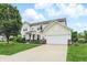 Charming two-story home with a well-manicured lawn and attached two-car garage at 1281 Jesse Ct, Greenwood, IN 46143