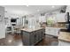 Open kitchen connected to the dining area, featuring granite counters and gray center island at 1281 Jesse Ct, Greenwood, IN 46143