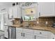 Bright kitchen features granite countertops, stainless steel dishwasher, and mosaic backsplash at 1281 Jesse Ct, Greenwood, IN 46143
