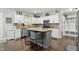 Stylish kitchen with granite counters, stainless appliances, and a gray island with seating at 1281 Jesse Ct, Greenwood, IN 46143