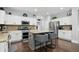 Stylish kitchen with granite counters, stainless appliances, and a gray island with seating at 1281 Jesse Ct, Greenwood, IN 46143