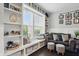Comfortable living room featuring hardwood floors, built-in shelving, and natural light at 1281 Jesse Ct, Greenwood, IN 46143