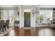 Elegant living room featuring hardwood floors, natural light, and stylish built-in shelving at 1281 Jesse Ct, Greenwood, IN 46143