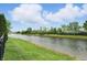 Picturesque pond with lush greenery and a fountain feature, enhancing the property's charm at 1281 Jesse Ct, Greenwood, IN 46143