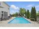 Sparkling inground pool surrounded by well maintained landscaping, perfect for relaxation at 1281 Jesse Ct, Greenwood, IN 46143