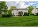 Spacious backyard featuring a lush green lawn and inviting patio area at 13271 Aquamarine Dr, Carmel, IN 46033