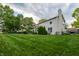 Well-maintained backyard with a large, pristine lawn and mature trees at 13271 Aquamarine Dr, Carmel, IN 46033