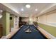 Finished basement space with a pool table and custom wet bar at 13271 Aquamarine Dr, Carmel, IN 46033