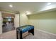 Basement game room featuring a foosball table and neutral carpeting at 13271 Aquamarine Dr, Carmel, IN 46033