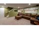 Finished basement with cozy seating, carpeted floors, and neutral walls at 13271 Aquamarine Dr, Carmel, IN 46033