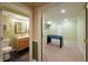 Bathroom and game room separated by open doorway at 13271 Aquamarine Dr, Carmel, IN 46033