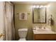 Cozy bathroom with stylish fixtures, wooden vanity, and decorative mirror at 13271 Aquamarine Dr, Carmel, IN 46033