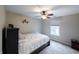 Cozy bedroom with ceiling fan, Spiderman decor, and a view of the backyard at 13271 Aquamarine Dr, Carmel, IN 46033
