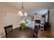 Cozy eat-in kitchen area with a view into a comfortably furnished living room with fireplace and shelving at 13271 Aquamarine Dr, Carmel, IN 46033