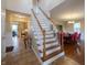 Spacious foyer showcases tile flooring, staircase, with views into the dining room and kitchen, and ample natural light at 13271 Aquamarine Dr, Carmel, IN 46033
