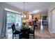 Bright eat-in kitchen with stainless steel appliances, tile flooring, and access to an outdoor patio at 13271 Aquamarine Dr, Carmel, IN 46033
