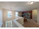 Second floor loft area with a large bookcase, comfortable futon and bright light at 13271 Aquamarine Dr, Carmel, IN 46033