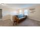 Second story loft space with a futon, natural light and comfortable furnishings at 13271 Aquamarine Dr, Carmel, IN 46033