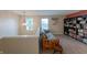 Cozy loft area with futon, chandelier lighting, and a full bookcase at 13271 Aquamarine Dr, Carmel, IN 46033