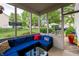 Relaxing screened porch with comfortable seating and a view of the backyard at 13271 Aquamarine Dr, Carmel, IN 46033
