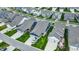 An aerial view of a neighborhood with beautiful single-Gathering homes featuring attached garages and manicured lawns at 1364 Chatham Hills Blvd, Westfield, IN 46074
