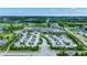 Aerial view of community clubhouse with ample parking, golf course, pool, tennis courts, and green surroundings at 1364 Chatham Hills Blvd, Westfield, IN 46074
