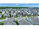 An aerial view of a neighborhood featuring beautiful single-Gathering homes and well-manicured lawns on a sunny day at 1364 Chatham Hills Blvd, Westfield, IN 46074