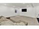 Inviting basement living area with cozy seating, neutral carpeting and recessed lighting at 1364 Chatham Hills Blvd, Westfield, IN 46074
