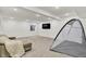 Comfortable basement featuring neutral colored walls and lounge area with a cozy blanket at 1364 Chatham Hills Blvd, Westfield, IN 46074