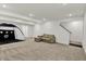 Spacious basement featuring neutral carpeting, ample lighting, and a comfortable lounge area at 1364 Chatham Hills Blvd, Westfield, IN 46074