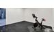 Home gym with black rubber flooring featuring a stationary bike at 1364 Chatham Hills Blvd, Westfield, IN 46074