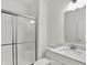 Bright bathroom showcasing a glass-enclosed shower and modern vanity with sleek fixtures at 1364 Chatham Hills Blvd, Westfield, IN 46074