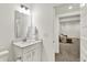 Bright bathroom features a modern vanity with sleek fixtures and a well-lit mirror at 1364 Chatham Hills Blvd, Westfield, IN 46074