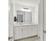 Bathroom with double sink vanity, large mirror, and quartz countertop at 1364 Chatham Hills Blvd, Westfield, IN 46074