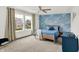 Cozy bedroom with blue wave wallpaper, a ceiling fan, and a bright window at 1364 Chatham Hills Blvd, Westfield, IN 46074