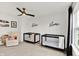 Shared bedroom features two cribs, a ceiling fan, and large window at 1364 Chatham Hills Blvd, Westfield, IN 46074