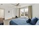 Bright bedroom with plush carpeting, a ceiling fan, and a large window offering neighborhood views at 1364 Chatham Hills Blvd, Westfield, IN 46074