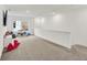 Light-filled bonus room with neutral carpet, white walls, and play area at 1364 Chatham Hills Blvd, Westfield, IN 46074