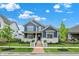 Charming two-story home with a brick walkway, manicured lawn, and a beautiful blue exterior at 1364 Chatham Hills Blvd, Westfield, IN 46074