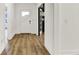 Bright foyer with hardwood flooring, white walls, and views into adjacent rooms through glass doors at 1364 Chatham Hills Blvd, Westfield, IN 46074