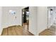 Well-lit foyer featuring hardwood floors, white walls, and multiple doorways leading to other rooms at 1364 Chatham Hills Blvd, Westfield, IN 46074