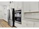 Bright kitchen featuring stainless steel appliances and white cabinetry with modern finishes at 1364 Chatham Hills Blvd, Westfield, IN 46074