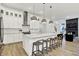 Bright kitchen with a large island, stainless steel appliances, and open layout to the living area at 1364 Chatham Hills Blvd, Westfield, IN 46074