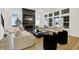 Spacious living room with large windows, a fireplace, neutral-toned furniture, and hardwood flooring at 1364 Chatham Hills Blvd, Westfield, IN 46074