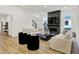 Bright living room with a fireplace, mounted television, modern furnishings, and large windows at 1364 Chatham Hills Blvd, Westfield, IN 46074