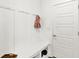 Mudroom with built-in bench, storage cubbies, hooks, and adjacent white door at 1364 Chatham Hills Blvd, Westfield, IN 46074